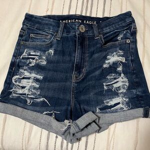 Distressed Curvy High Rise Shortie | Denim Shorts | American Eagle